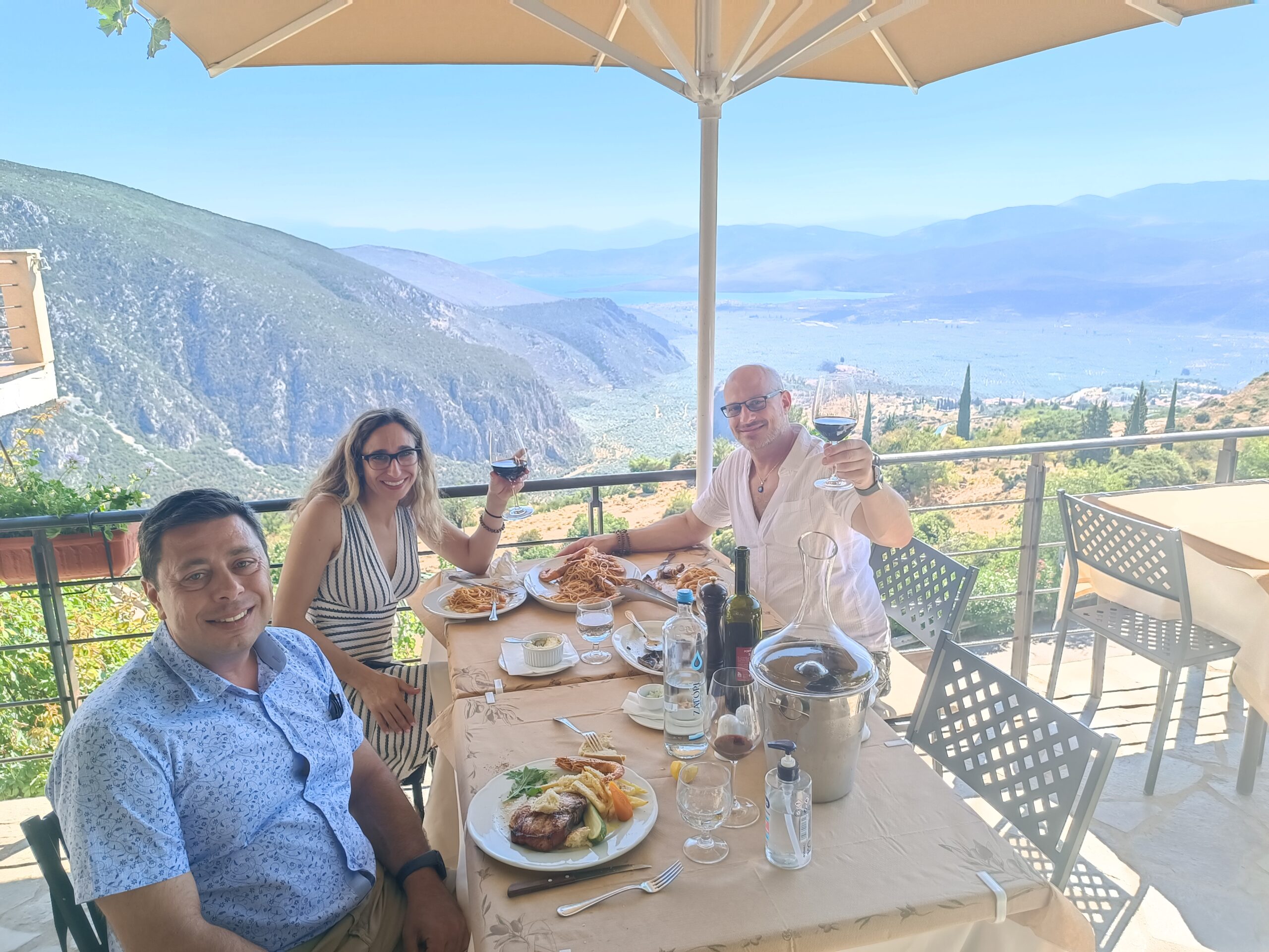 3 people pose in a restaurant in Delphi